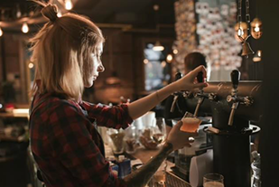Picture of a bartender serving in a bar
