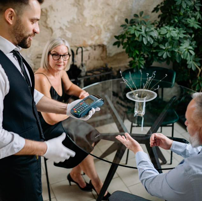 Picture of a waiter in a restaurant  