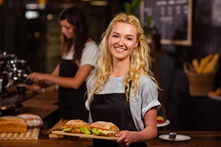 Picture of a waiter serving food in a restaurant